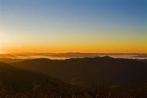 Sunrise In The Mountains On A Cloudless Day Photograph By Michael
