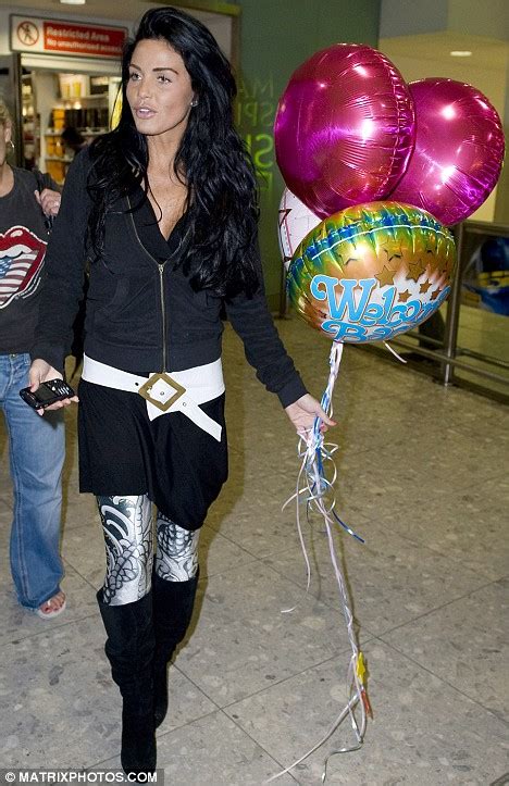 hello britain katie price jets back to london and gets welcome home balloons daily mail online