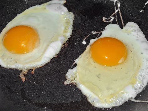 I fry my eggs over medium heat, just below the oil's smoke point. File:Fried eggs.jpg - Wikimedia Commons