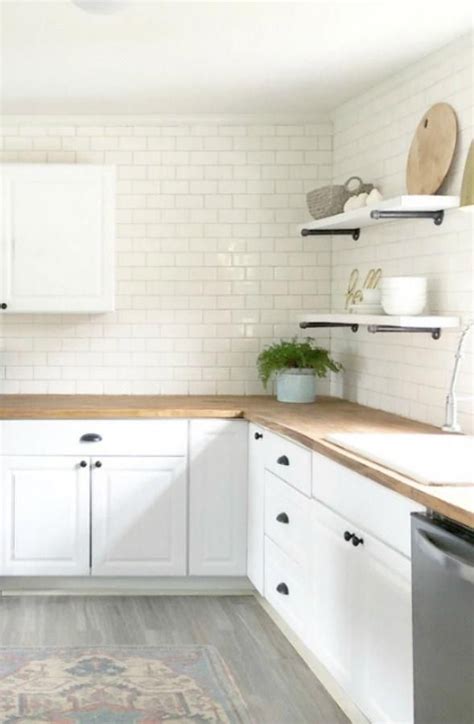 Charming White Subway Tile On Backsplash In Modern Farmhouse Kitchen