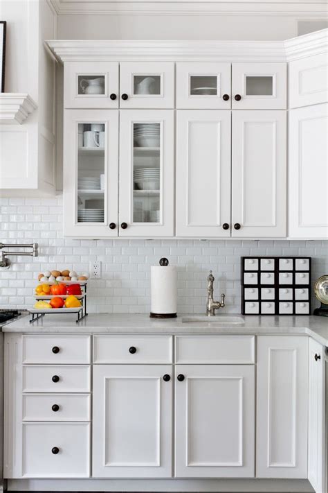 Decorative wood trim for kitchen cabinets. subway tile kitchen Kitchen Traditional with all white ...