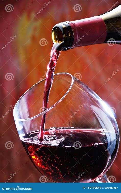 Red Wine Being Poured Into Wine Glass Stock Image Image Of Abstract