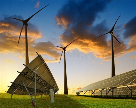 Solar Panels With Wind Turbines At Sunset Stock Photo Image Of