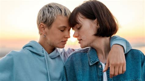 Close Up Of Young Sensual Lesbian Couple Going To Kiss Two Women
