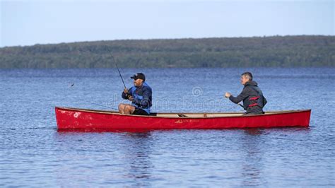 Casting For Small Mouth Bass From A Red Canoe On Georgian Bay Editorial
