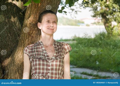 Portrait Of A Beautiful Mature Caucasian Woman Under A Tree Stock Image