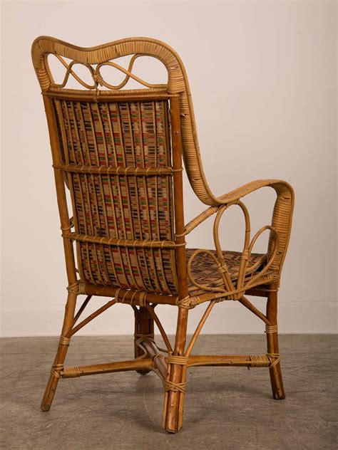 Handcrafted rattan + wood = the ultimate power couple. Vintage woven rattan armchair, France c.1920 at 1stdibs