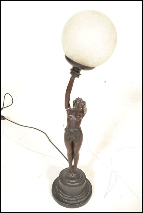 A Art Deco Style Table Lamp In The Form Of A Reclining Nude Lady