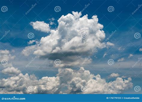 White Puffy Clouds On A Vivid Blue Sky In Sunny Day Stock Image Image