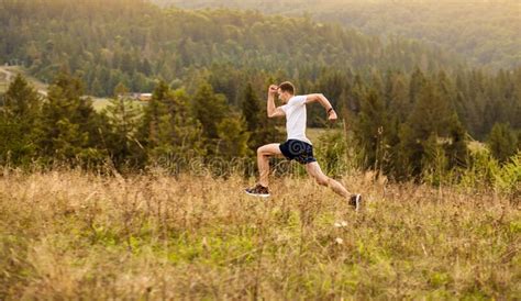 Running Fitness Man Sprinting Outdoors With Beautiful Mountains