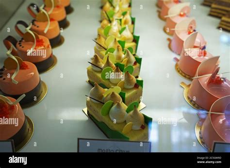 Assorted Flavor Colorful Eclair And French Pastry Bakery Displayed In