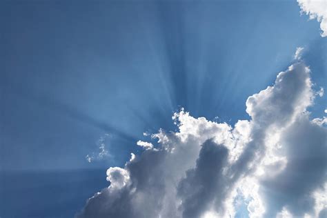 God Rays Soft Clouds And Radiating Sunbeams Photograph By Georgia