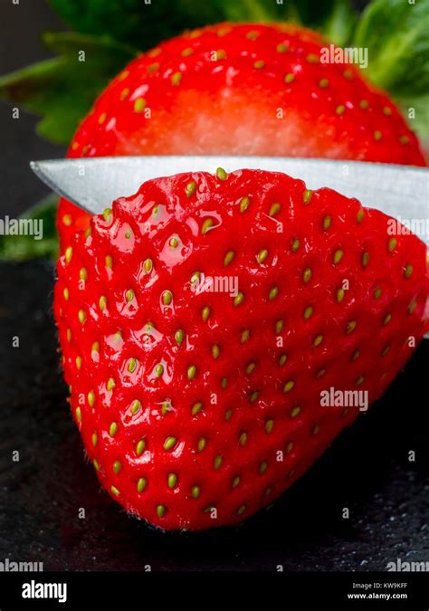 A Macro Photograph Of A Fresh Sliced Strawberry Stock Photo Alamy