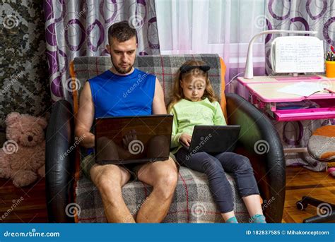 Dad And Daughter Are Sitting With Laptops On The Couch Stock Image Image Of Daughter Work