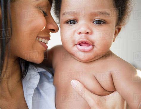 African American Mother Holding Baby Boy Stock Photo Dissolve