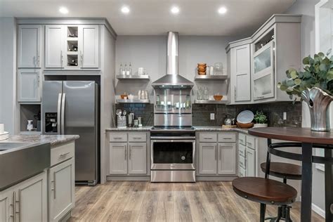 Transform your kitchen easily with 25 beautiful kitchen cabinet colors and favorite designer kitchen paint color combos from farmhouse to modern glam! colors-cabinets-OzarkShadowPaintedHardwood-example ...
