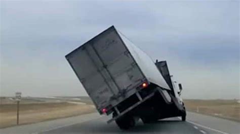 truck blown over by high winds on alberta s busiest highway cbc ca