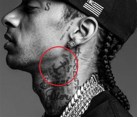 Nipsey Hussle Tattoos On His Face