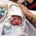 Pictured: Liverpool keeper Pepe Reina holds on to his newborn son with ...