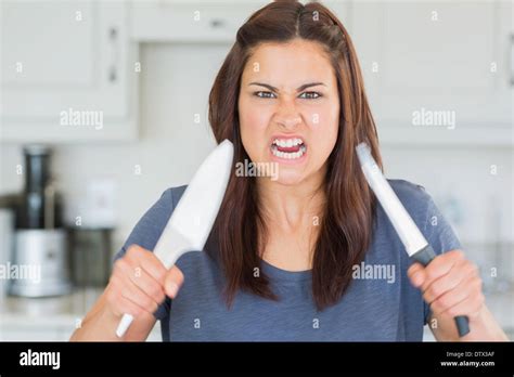 Woman Holding Knife Looking Angry Hi Res Stock Photography And Images