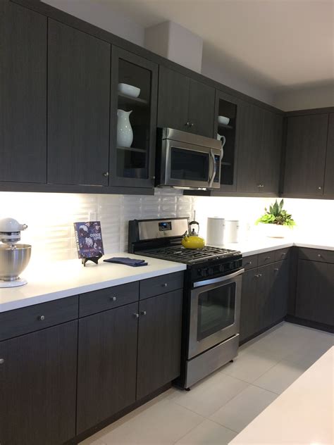White kitchen cabinets with cambria quartz countertops. Dark Brown/Black Kitchen Cabinets / Light Quartz ...
