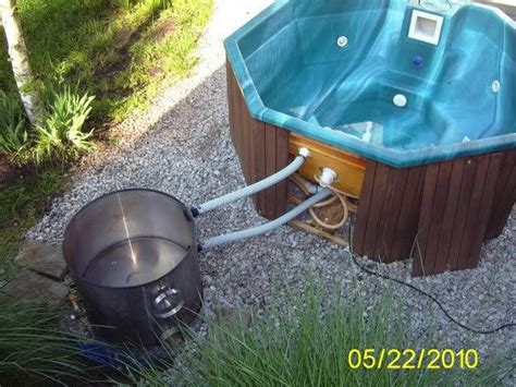 Old alh egr cooler heat exchanger, oriented vertically underhood, pilot light assembly underneath, thermosiphon providing pumping. wood fired hot tub heater (wood burning stoves forum at permies) | Hot tub outdoor, Outdoor tub ...