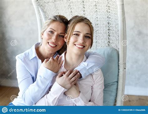 Happy Senior Mother Embracing Adult Daughter Laughing Together Stock Image Image Of Look Home