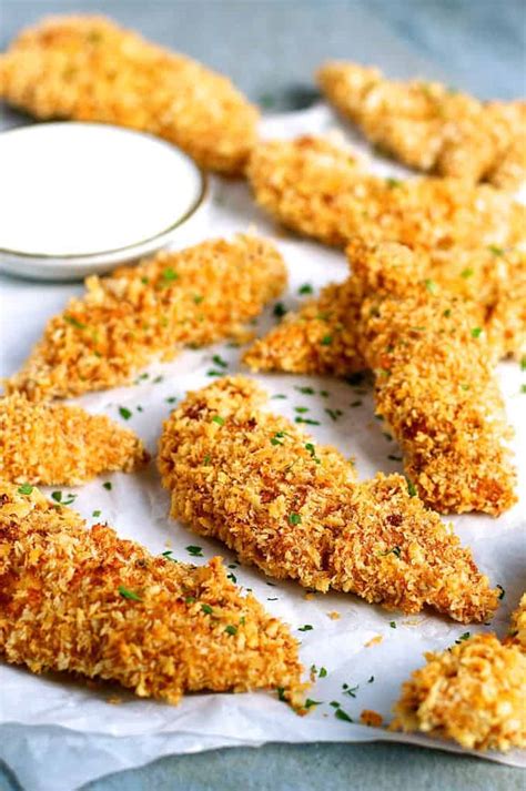 While you're breading your tenders, use one hand for dry ingredients and the other for wet ingredients to avoid messy fingertips! Truly Golden Crunchy Baked Chicken Tenders | RecipeTin Eats