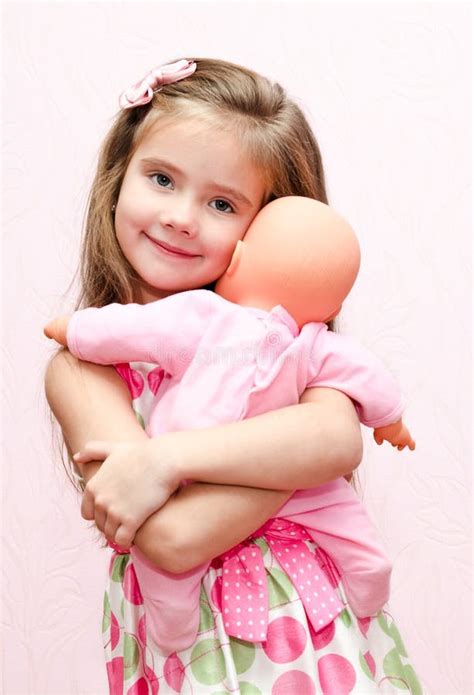 Cute Little Girl Holding And Embracing Her Doll Stock Image Image