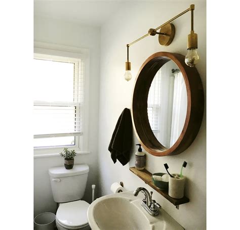 The placement of your bathroom sconces or vanity lights. Magazine_in_bathroom_1024x1024.jpg?v=1499744916