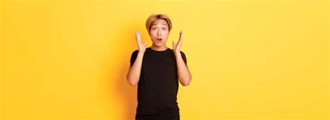 Free Photo Portrait Of Surprised Gasping Blond Asian Guy Reacting To Awesome News Yellow