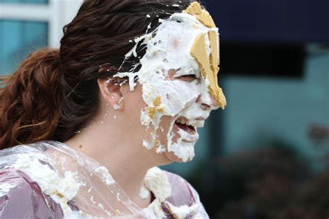 Bank Associates Are Pied In The Face For A Good Cause Business