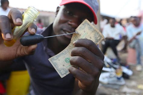 Zimbabweans Mend Shabby Dollar Notes Amid Economic Crisis Zimbabwe