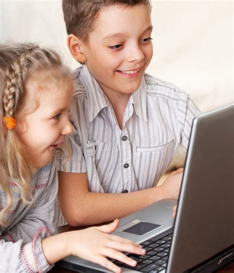 Happy Kids Playing Laptop At Home Stock Photo Image Of Computer