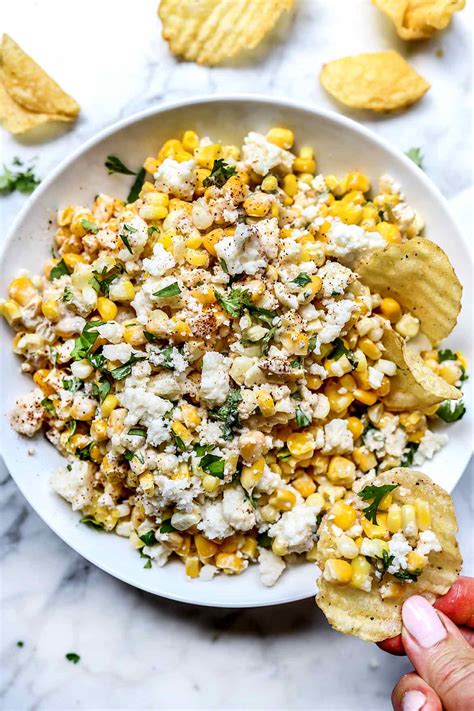 The cheeses are super ooey gooey and delicious, and combined with the sweet corn make this dip an absolute winner. Mexican Corn Dip (Hot or Cold!) | foodiecrush .com
