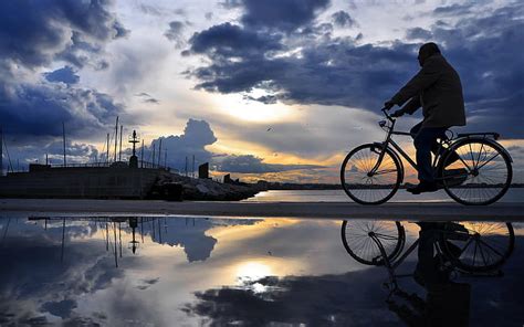 Hd Wallpaper Man Riding Bicycle On Mirror Surface Of Sky Anime Clouds