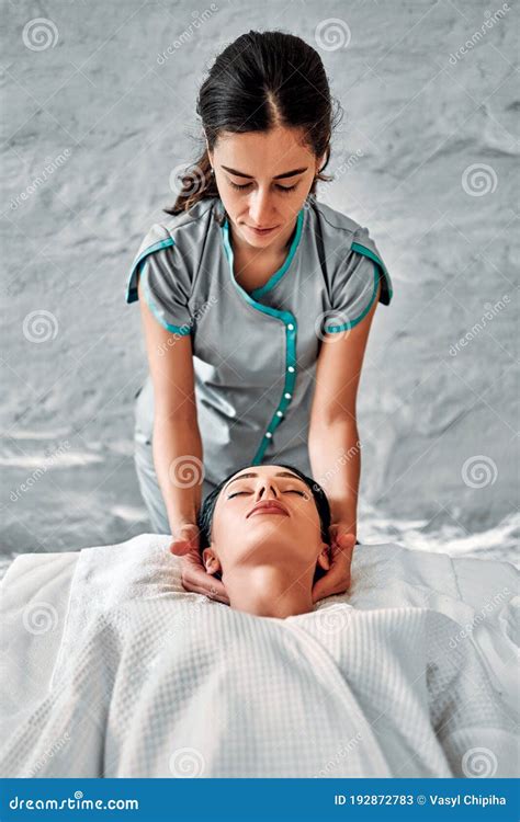 Masseur Makes Spa Massage The Face Of A Beautiful Girl Stock Image Image Of Hand Massaging