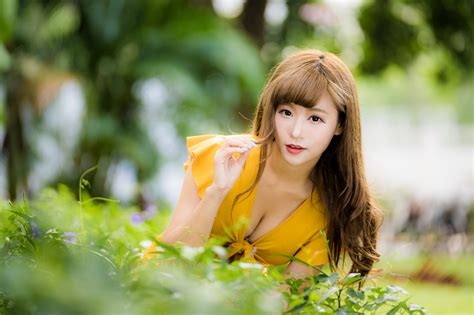 asian women model long hair brunette yellow tops trees bushes grass depth of field