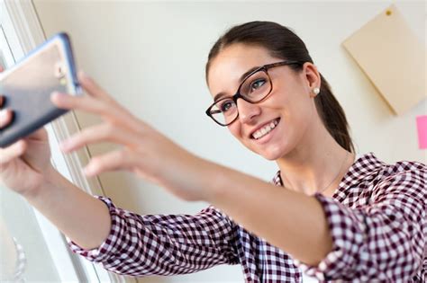premium photo female in glasses taking selfie