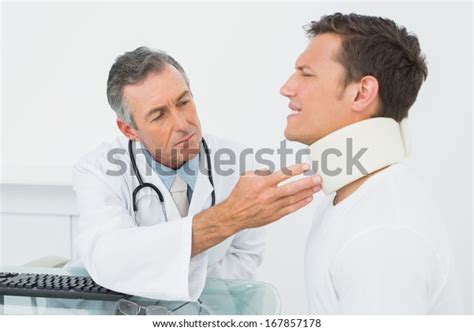 Male Doctor Examining Patient Desk Medical Stock Photo 167857178