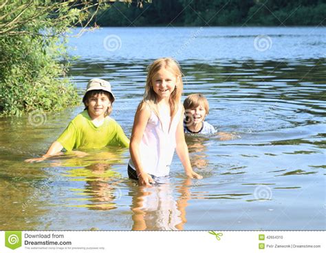Little Kids In Water Stock Photo Image Of Funny Stand 42654310