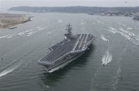 Sailors Aboard Uss Ronald Reagan Man The Rails As The Carrier Arrives