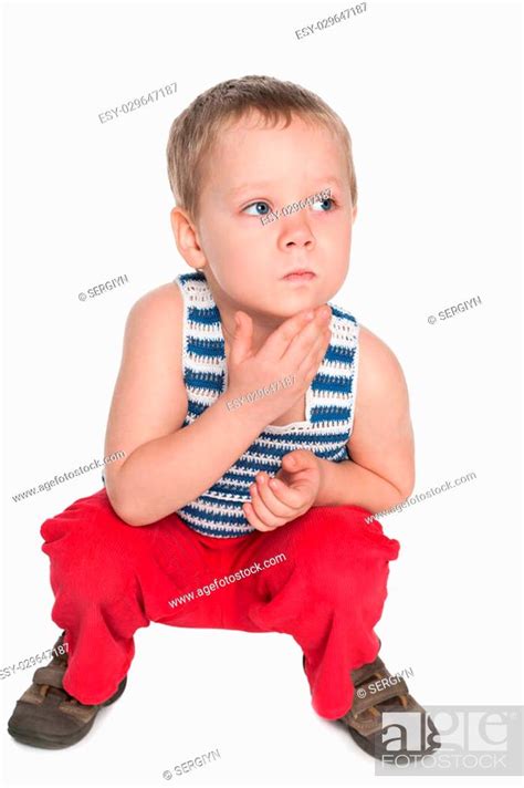 A Very Thoughtful Preschool Boy On The White Background Stock Photo