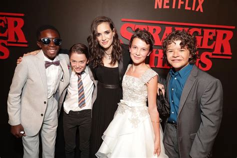 The Cast Of “stranger Things” Pose On The Netflix Series Red Carpet