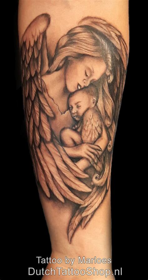 Https://tommynaija.com/tattoo/angel Holding Child Tattoo Designs