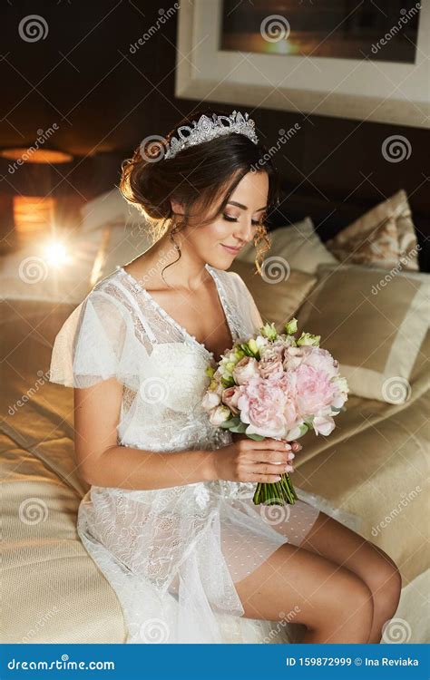 Beautiful Young Brunette Bride In White Lingerie And Modish Peignoir