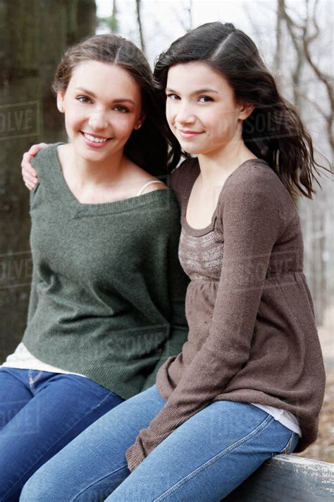 Two Teenage Girls 16 17 Sitting Together Portrait Stock Photo