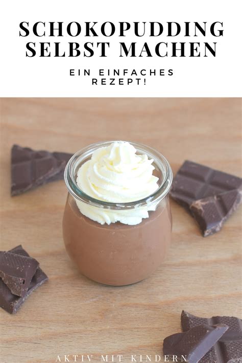 Chocolate Pudding In A Glass Jar With Whipped Cream On Top And Dark Chocolate Pieces Surrounding It