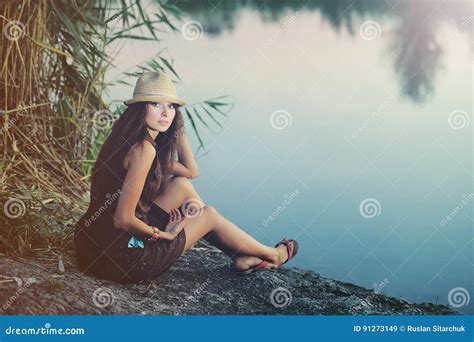 Woman Resting On The Banks Of The River In The Evening Stock Image Image Of Relax Female