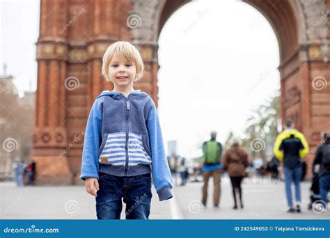 Cute Little Child Toddler Boy Playing In Front Of Arc De Triumph In